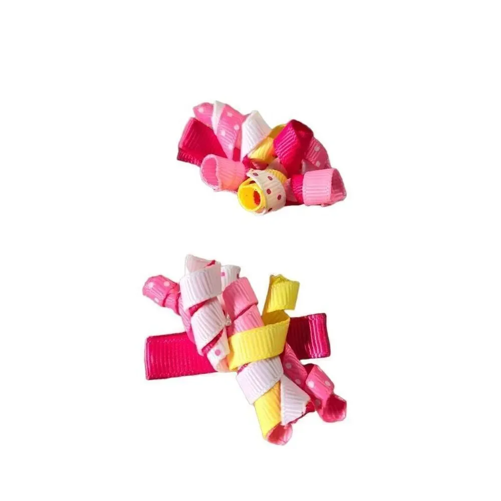 2 sets of infant twirly bows, 2